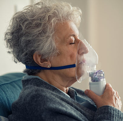 Woman using nebulizer