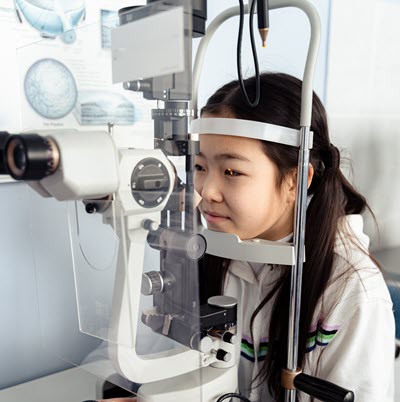 A young girl is having an eye exam
