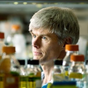Dr. Lindsay Eltis stands in his laboratory looking into the distance
