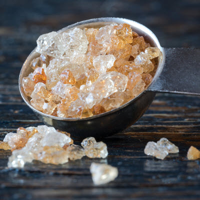 Guar gum crystals in a measuring spoon